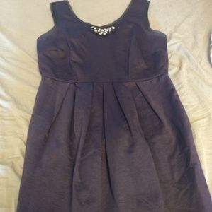 Dark purple cocktail dress with jewels and pockets